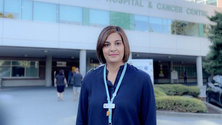 Ruby Gidda standing in front of the BC Cancer - Abbotsford building