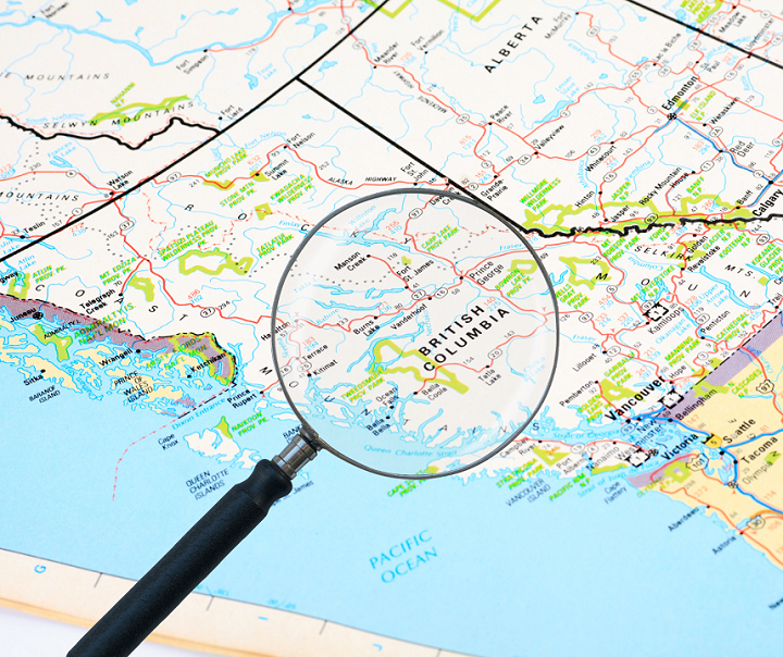 A map of British Columbia with a magnifying glass over it