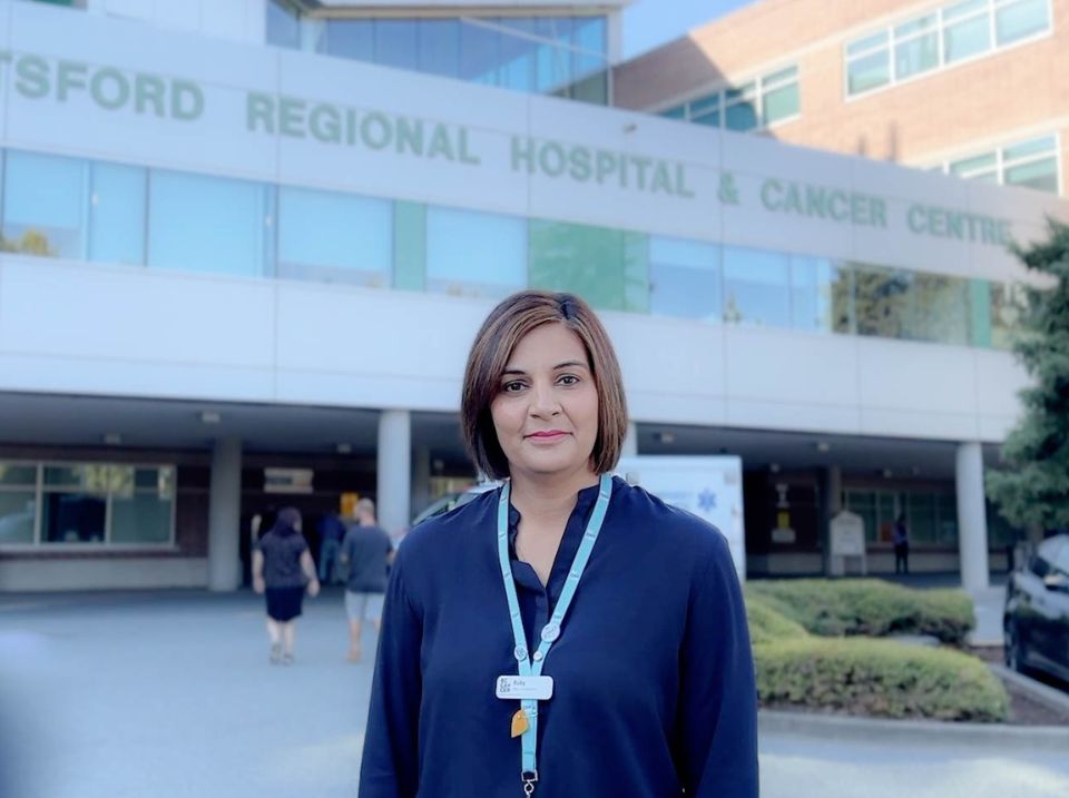 Ruby Gidda standing in front of the BC Cancer - Abbotsford building