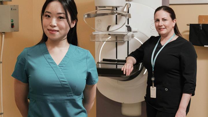 Two Technologists with a mammography machine
