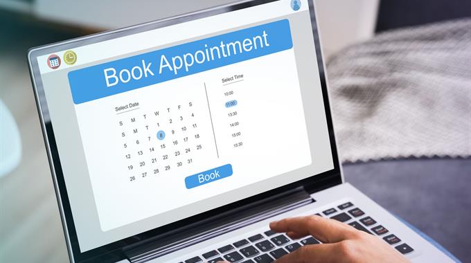 Computer screening showing a calendar to book an appointment